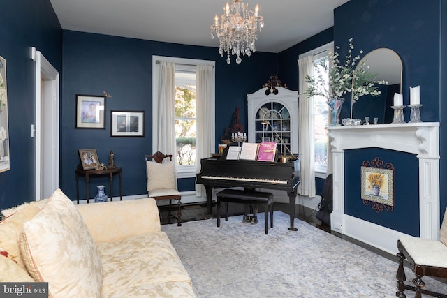 living area featuring hardwood / wood-style floors and an inviting chandelier