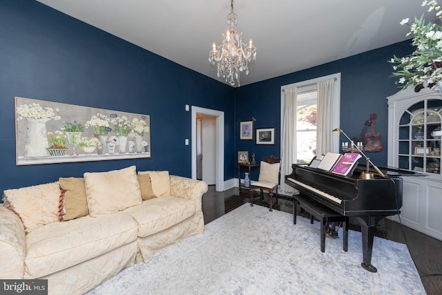 living area featuring hardwood / wood-style floors and an inviting chandelier