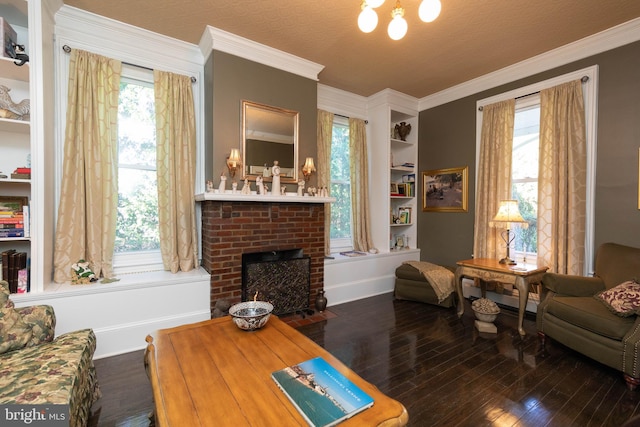 sitting room featuring a textured ceiling, dark hardwood / wood-style floors, a brick fireplace, and ornamental molding