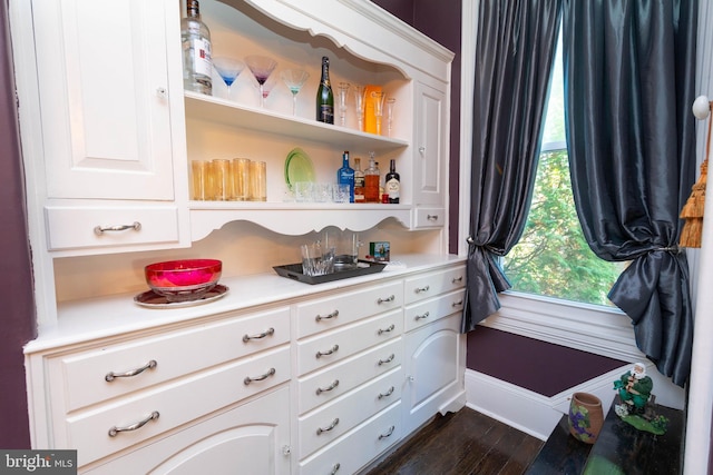 walk in closet featuring dark wood-type flooring