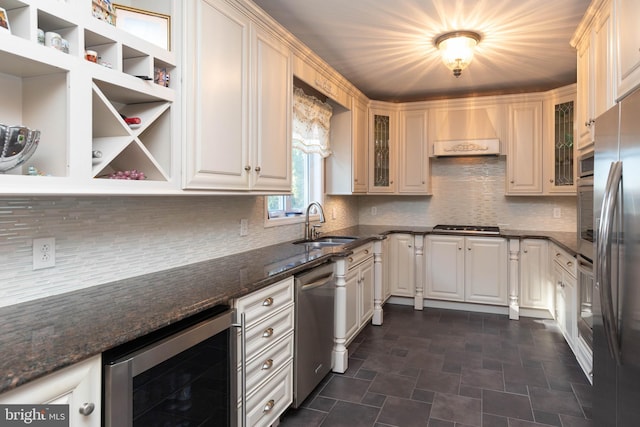 kitchen featuring premium range hood, dark stone countertops, tasteful backsplash, stainless steel appliances, and beverage cooler