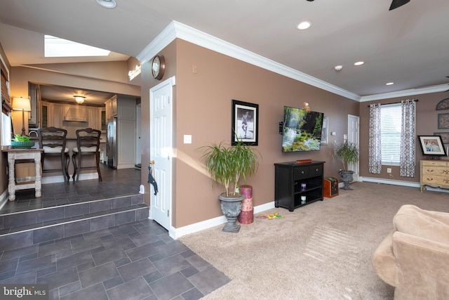 living room with dark carpet, ornamental molding, and a skylight