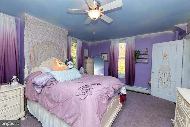 carpeted bedroom with baseboard heating and ceiling fan