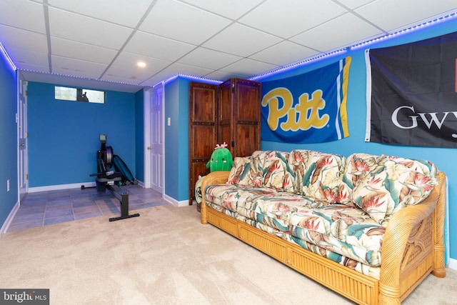 interior space featuring a paneled ceiling and tile patterned floors