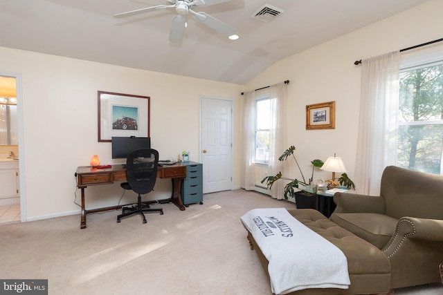 office area featuring light colored carpet, plenty of natural light, lofted ceiling, and ceiling fan