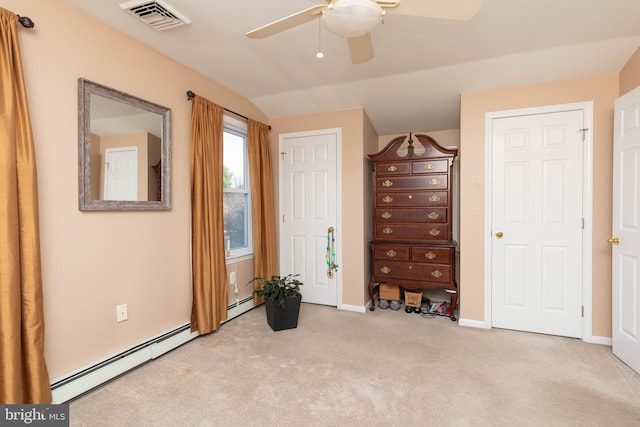 carpeted bedroom featuring baseboard heating, ceiling fan, and vaulted ceiling