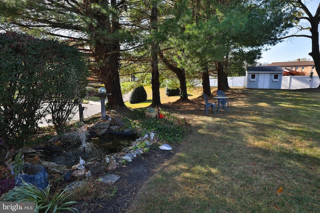 view of yard with a storage unit