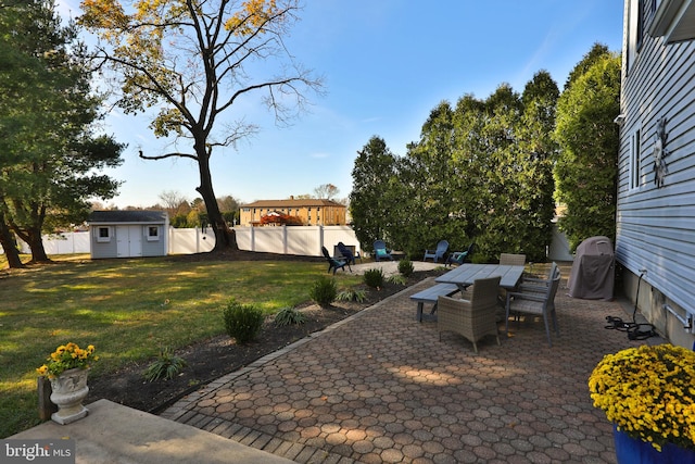 view of patio / terrace with a storage unit