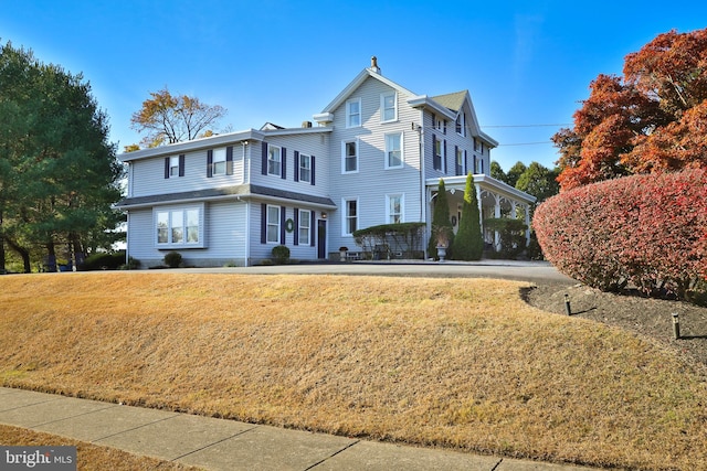 view of front property with a front lawn