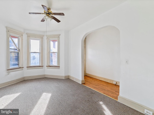 unfurnished room with ceiling fan and hardwood / wood-style floors