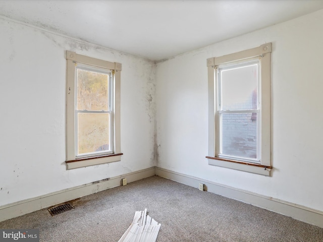 unfurnished room featuring carpet flooring