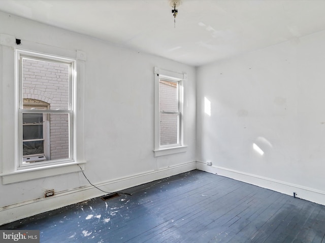 empty room with dark hardwood / wood-style floors