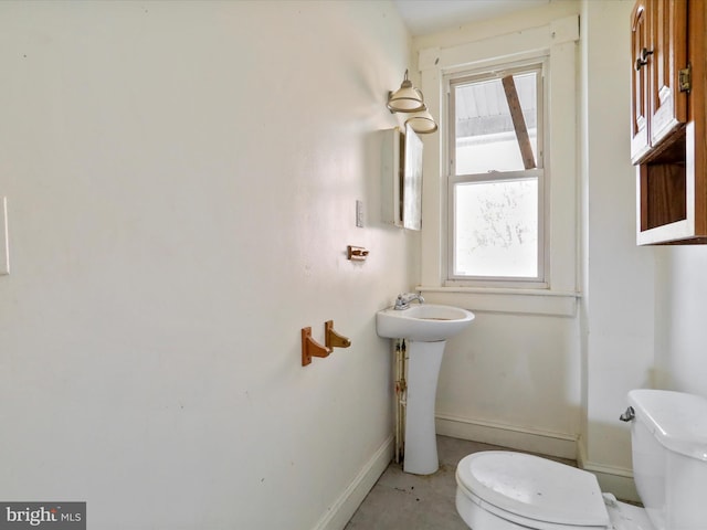 bathroom with toilet and sink