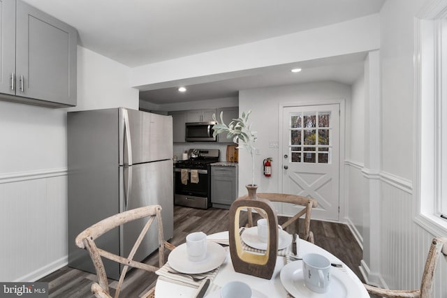 dining space with dark hardwood / wood-style flooring and a wealth of natural light