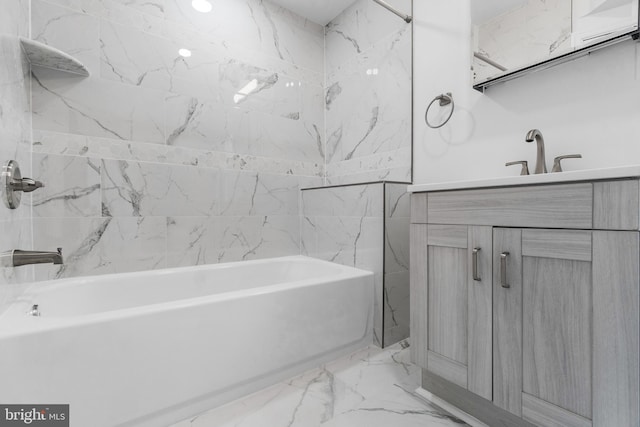 bathroom with vanity and tiled shower / bath combo