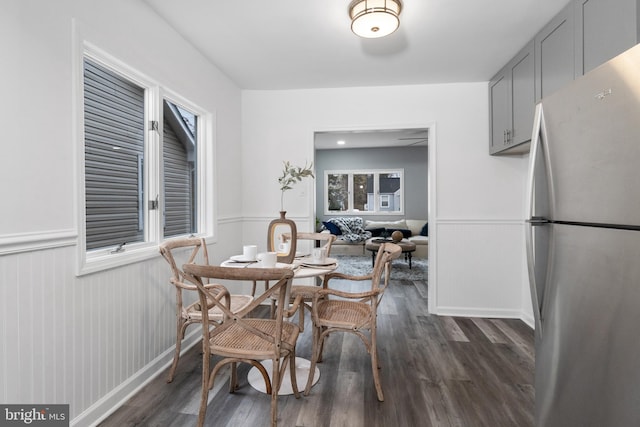 dining space featuring dark hardwood / wood-style flooring