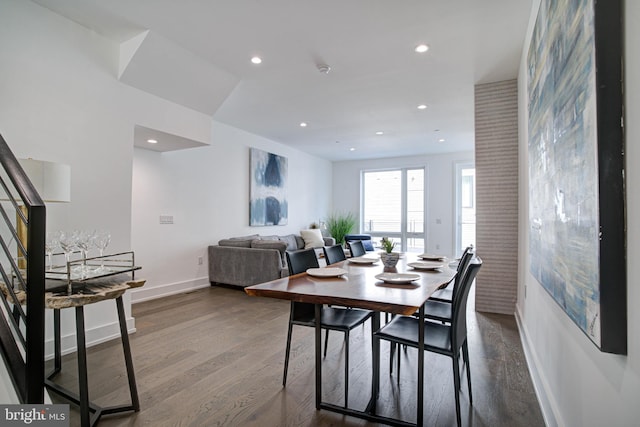 dining area featuring dark hardwood / wood-style floors