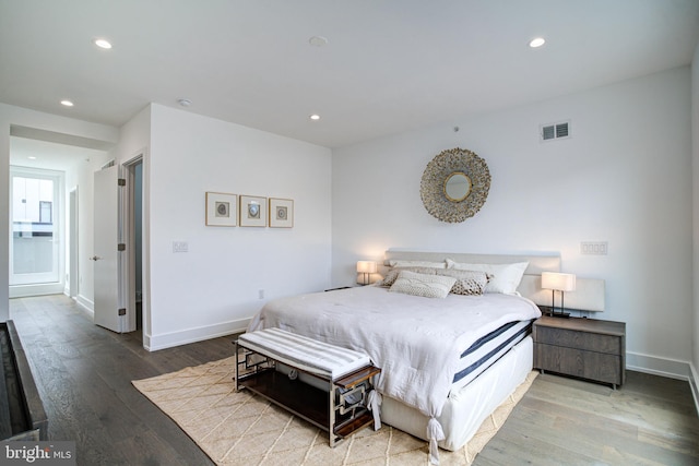 bedroom with hardwood / wood-style floors