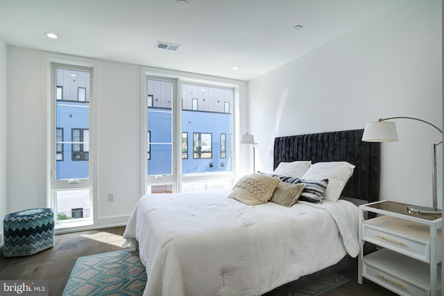 bedroom featuring dark hardwood / wood-style flooring