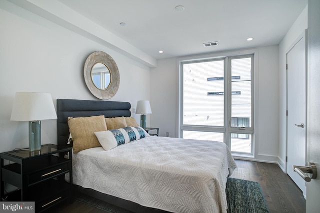 bedroom featuring dark hardwood / wood-style flooring