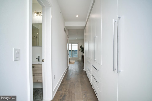 hallway with dark wood-type flooring