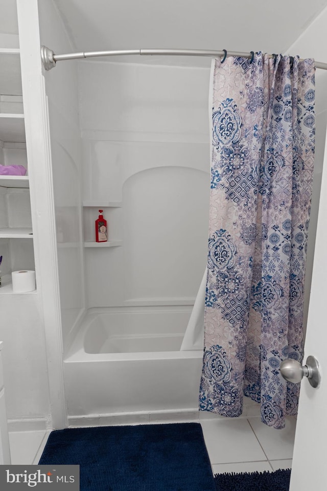 bathroom featuring tile patterned floors and shower / tub combo with curtain