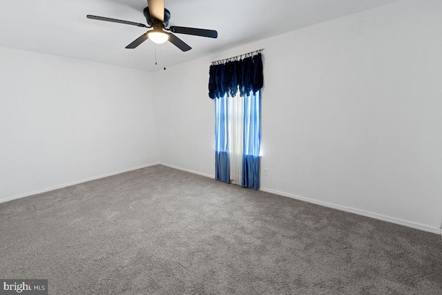 empty room featuring ceiling fan and carpet floors