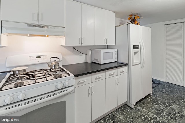 kitchen featuring white cabinets and white appliances