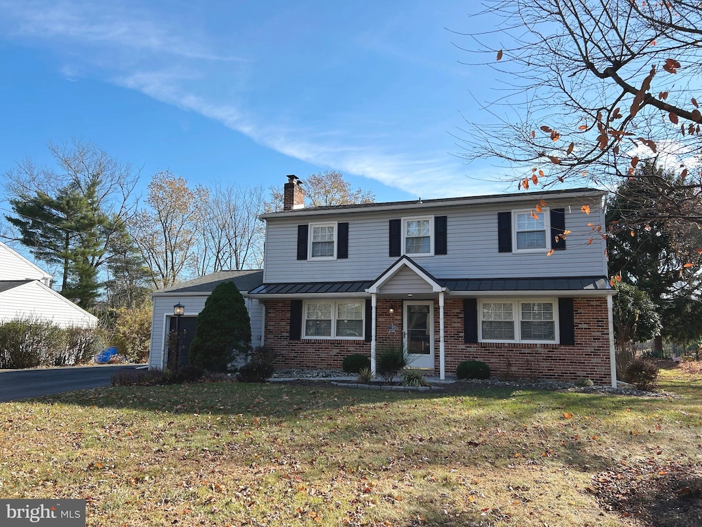 front facade with a front lawn