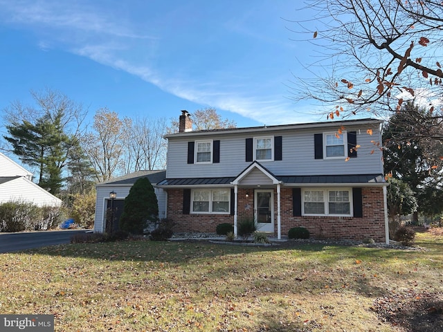 front facade with a front lawn