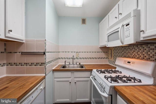 kitchen with sink, wood counters, backsplash, white appliances, and white cabinets