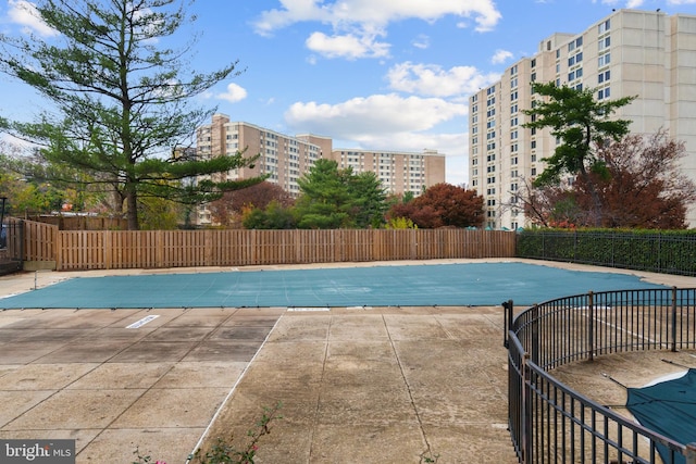 view of pool featuring a patio