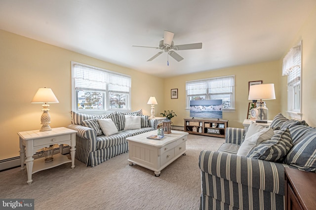 living room with ceiling fan, light colored carpet, and a wealth of natural light