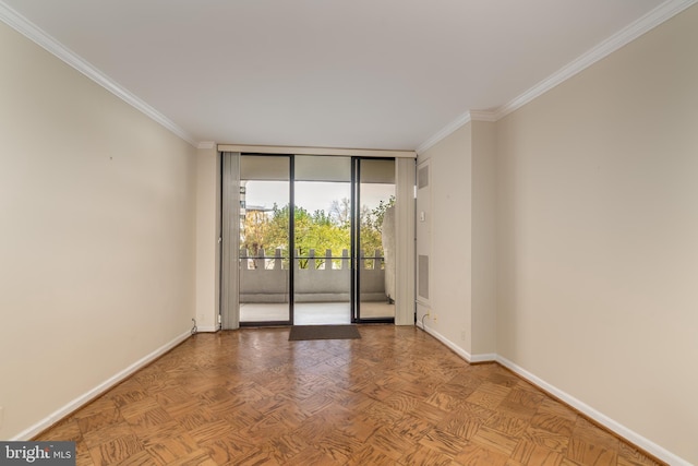 spare room with expansive windows, ornamental molding, and parquet flooring