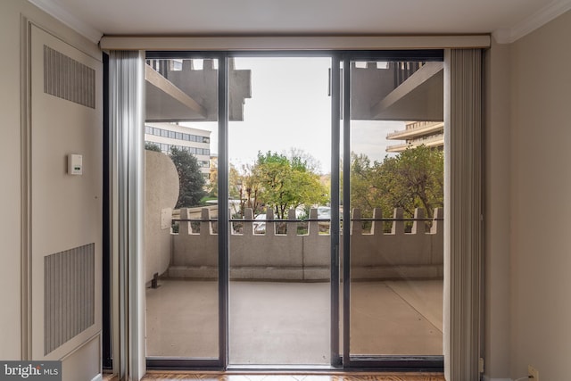 doorway featuring ornamental molding