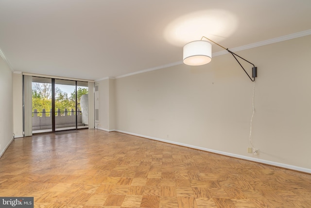 empty room featuring a wall of windows, light parquet floors, and ornamental molding