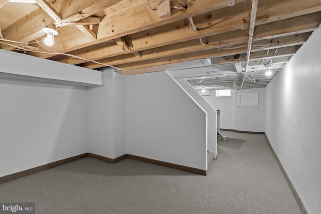 basement featuring carpet flooring