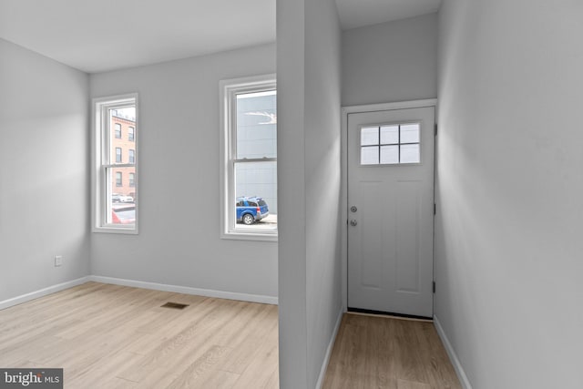 entryway with light hardwood / wood-style flooring