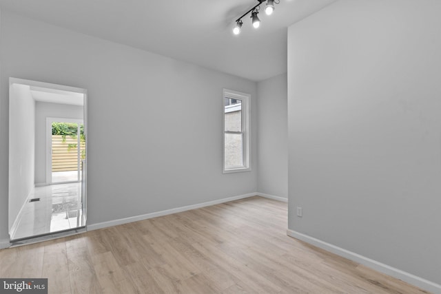 unfurnished room featuring light hardwood / wood-style flooring