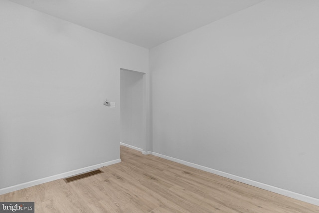 empty room with light hardwood / wood-style flooring