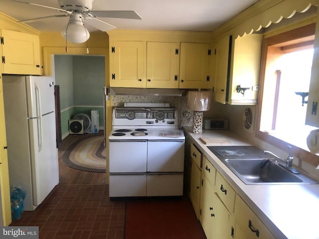 kitchen featuring white appliances, tasteful backsplash, ceiling fan, and sink