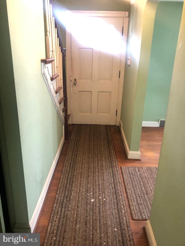 hallway featuring hardwood / wood-style floors