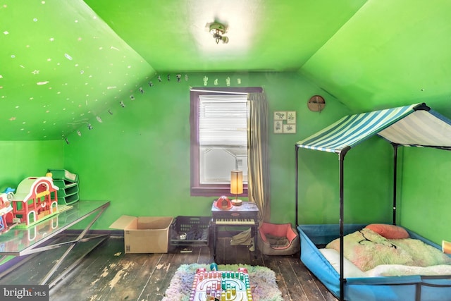 bonus room with lofted ceiling and dark wood-type flooring