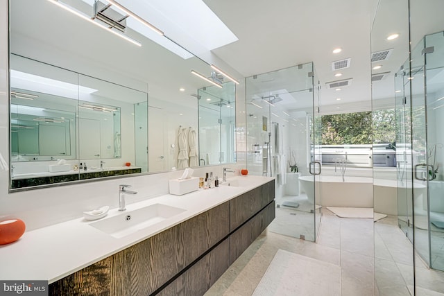 bathroom with vanity, tile patterned floors, and shower with separate bathtub