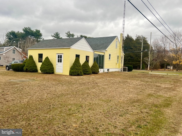 view of side of property with a yard