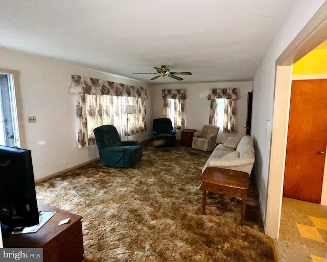 living room with ceiling fan and carpet floors