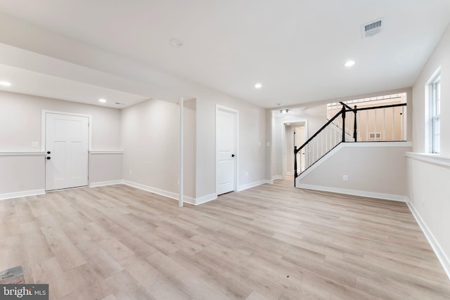 basement featuring light hardwood / wood-style floors