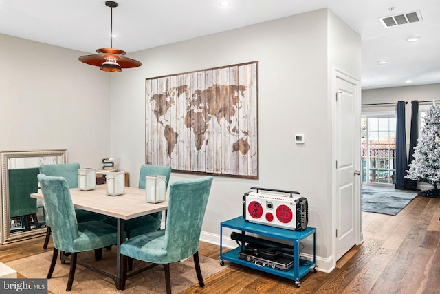 dining area featuring hardwood / wood-style floors