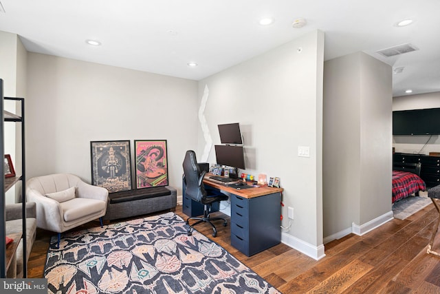 office space with dark hardwood / wood-style flooring