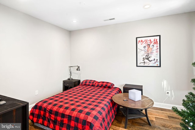 bedroom featuring wood-type flooring